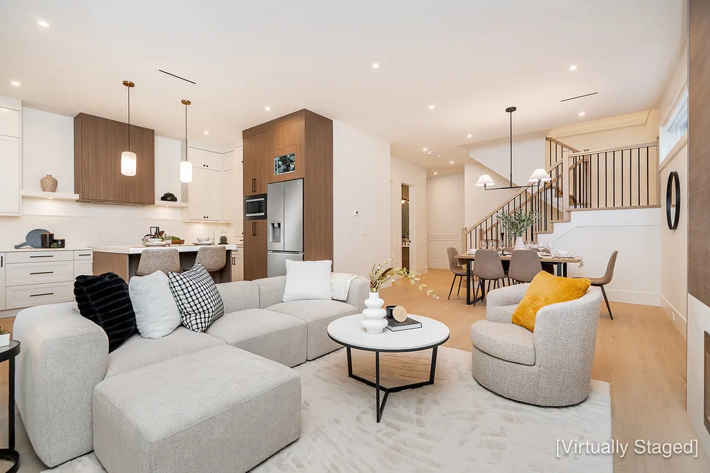 Open-plan living room looking to the kitchen and stair