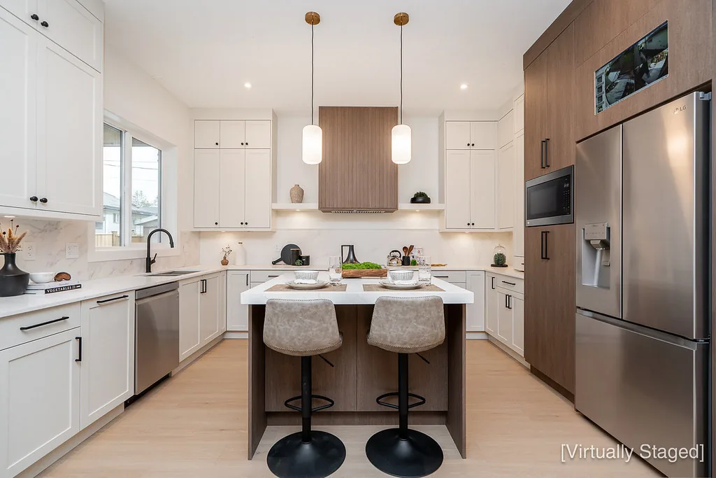 White kitchen with walnut island and pendant lights